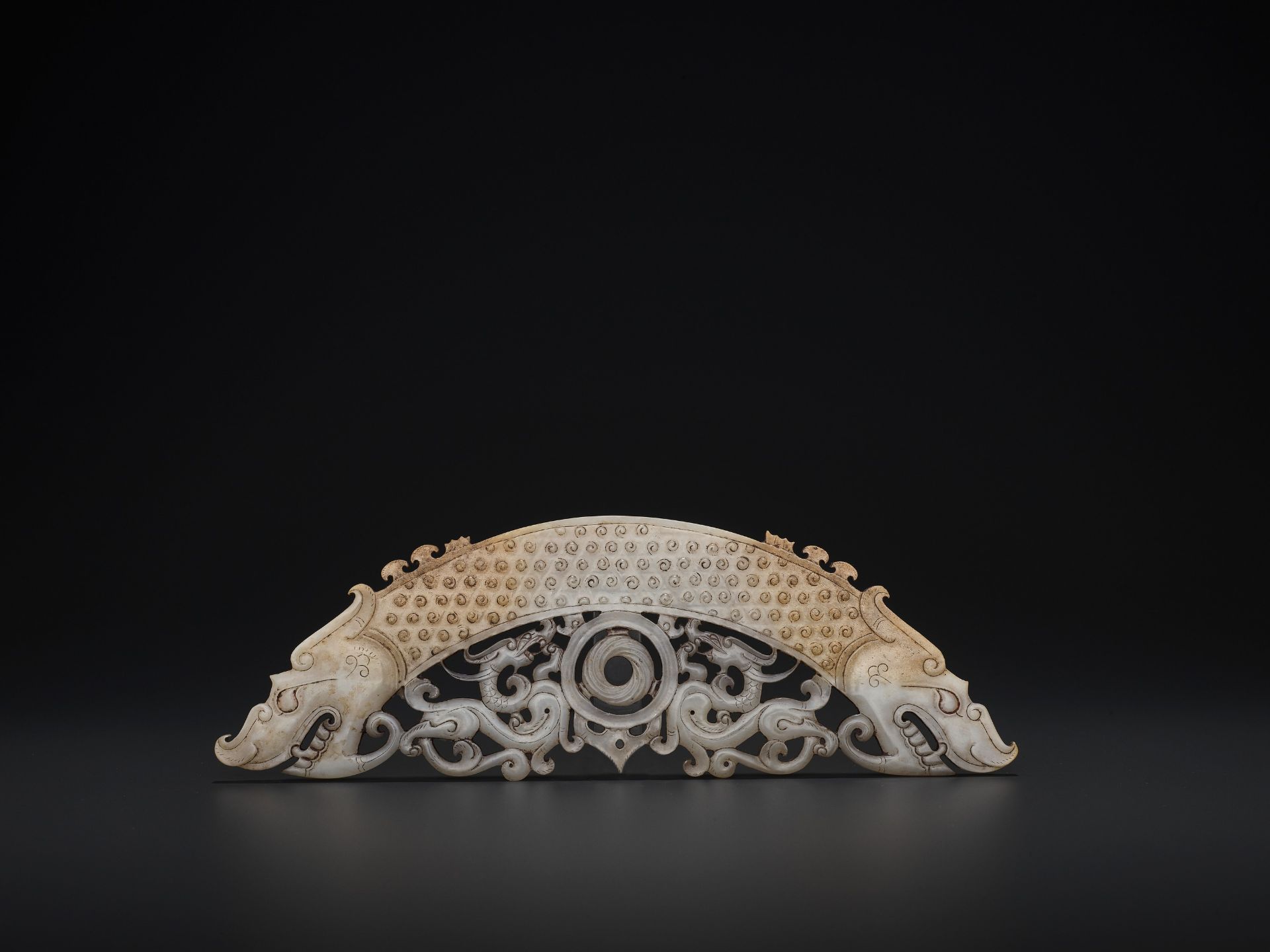 A WHITE AND RUSSET JADE 'DOUBLE DRAGON' PENDANT, HUANG, LATE EASTERN ZHOU TO HAN - Image 2 of 9