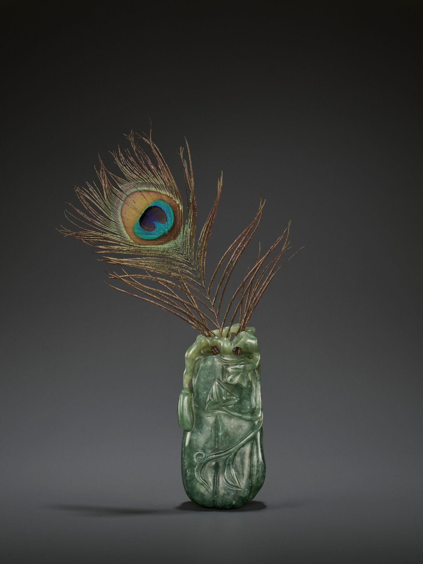 A DARK GREEN JADEITE 'MELON' SOLIFLORE VASE, QING