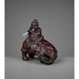 A BAMBOO-ROOT 'ELEPHANT AND BOY' CARVING, EARLY QING DYNASTY