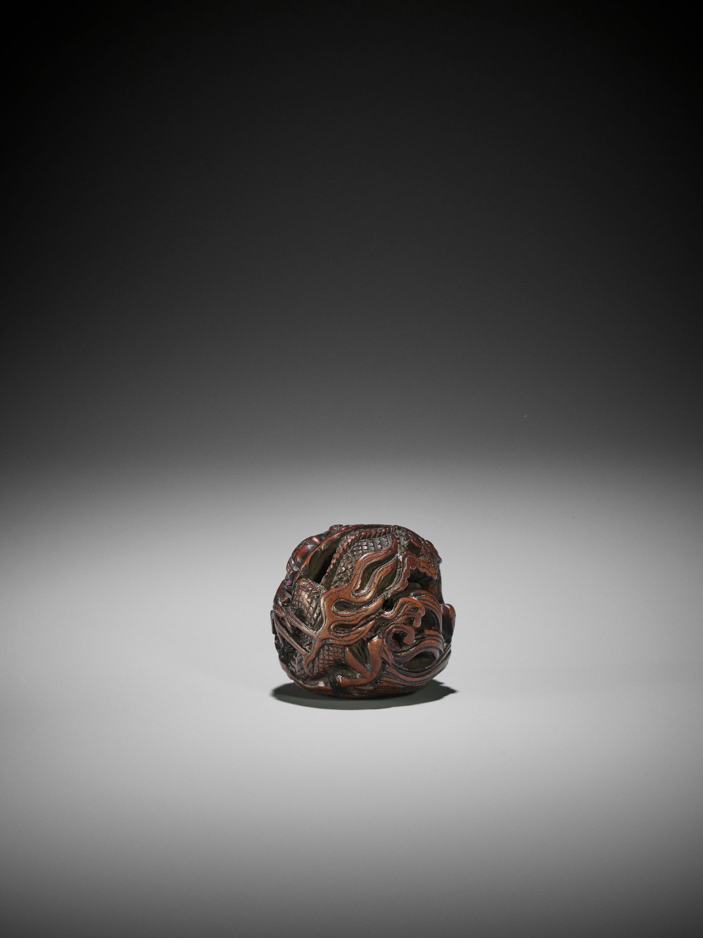 A POWERFUL WOOD NETSUKE OF A COILED DRAGON - Image 2 of 8