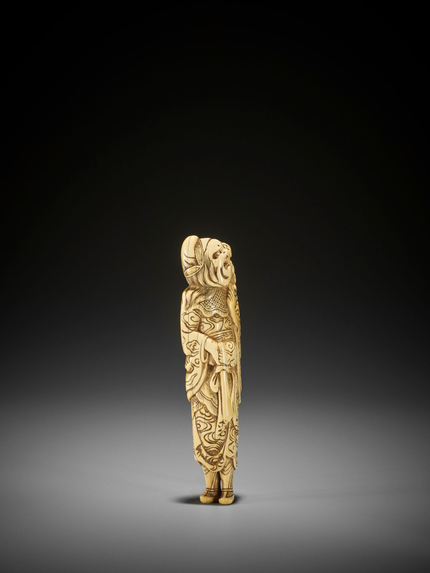 A MONUMENTALLY TALL IVORY NETSUKE OF SHOKI AND ONI - Image 6 of 8