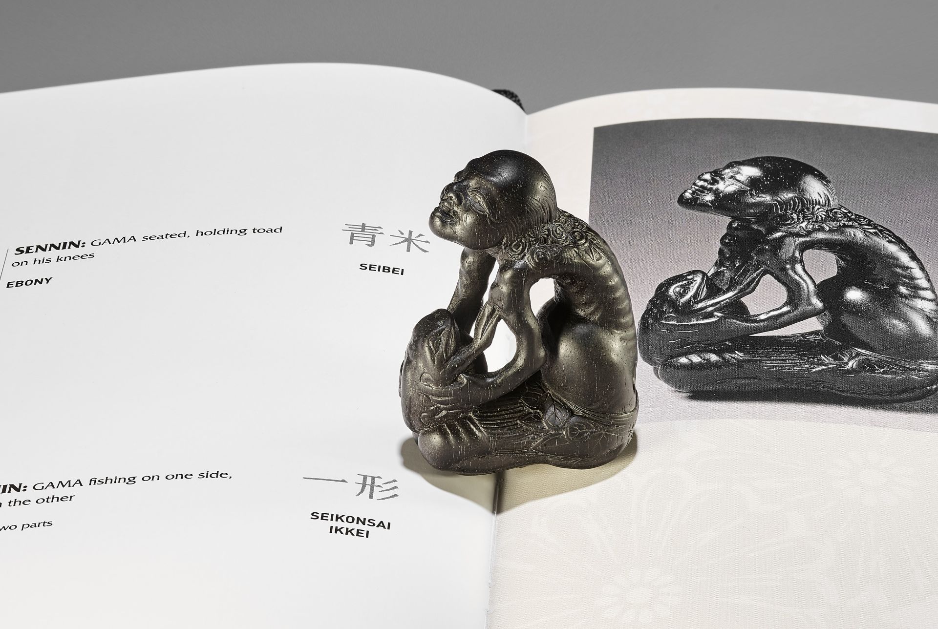 KIYOSHI: A LARGE EBONY NETSUKE OF GAMA SENNIN AND HIS TOAD