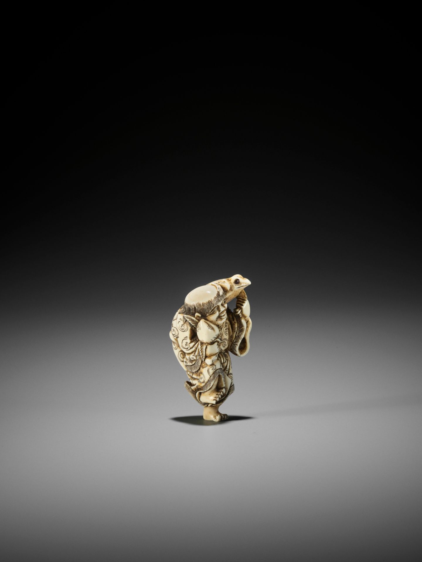 YOSHINAGA: AN IVORY NETSUKE OF GAMA SENNIN WITH A PEACH AND HIS THREE-LEGGED TOAD - Image 4 of 11