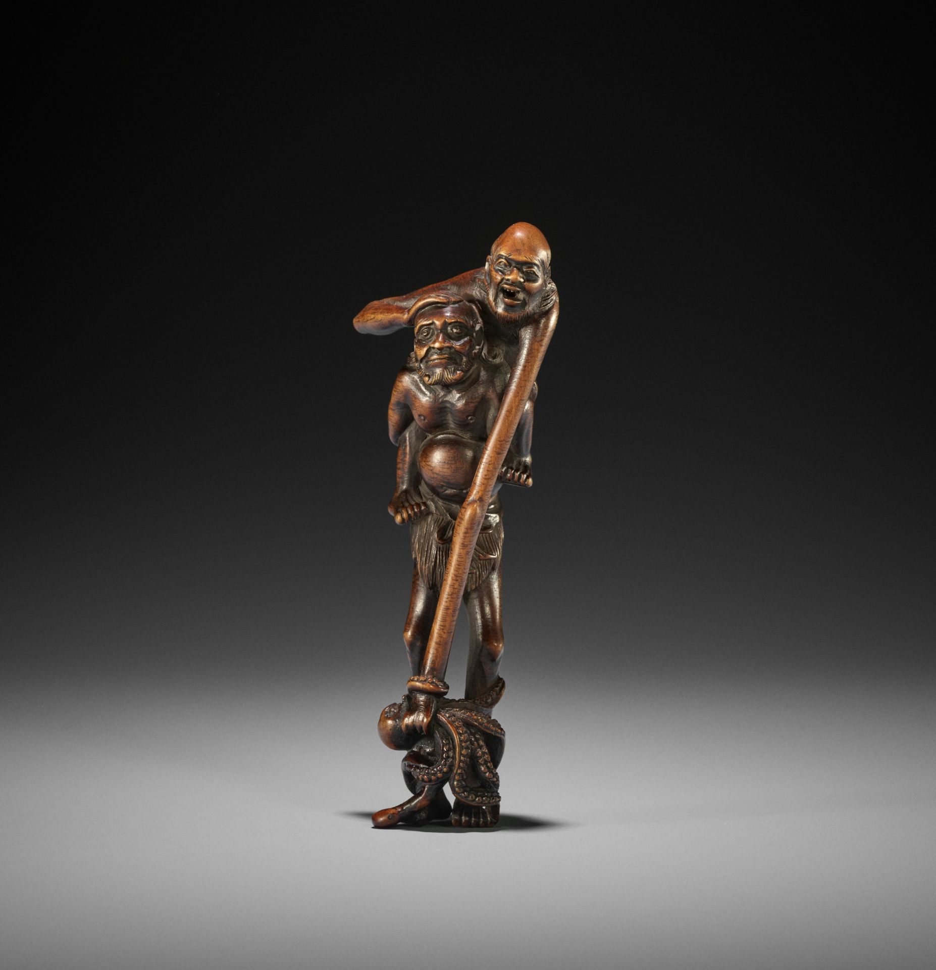 KAZUHIDE: A TALL WOOD NETSUKE OF ASHINAGA AND TENAGA