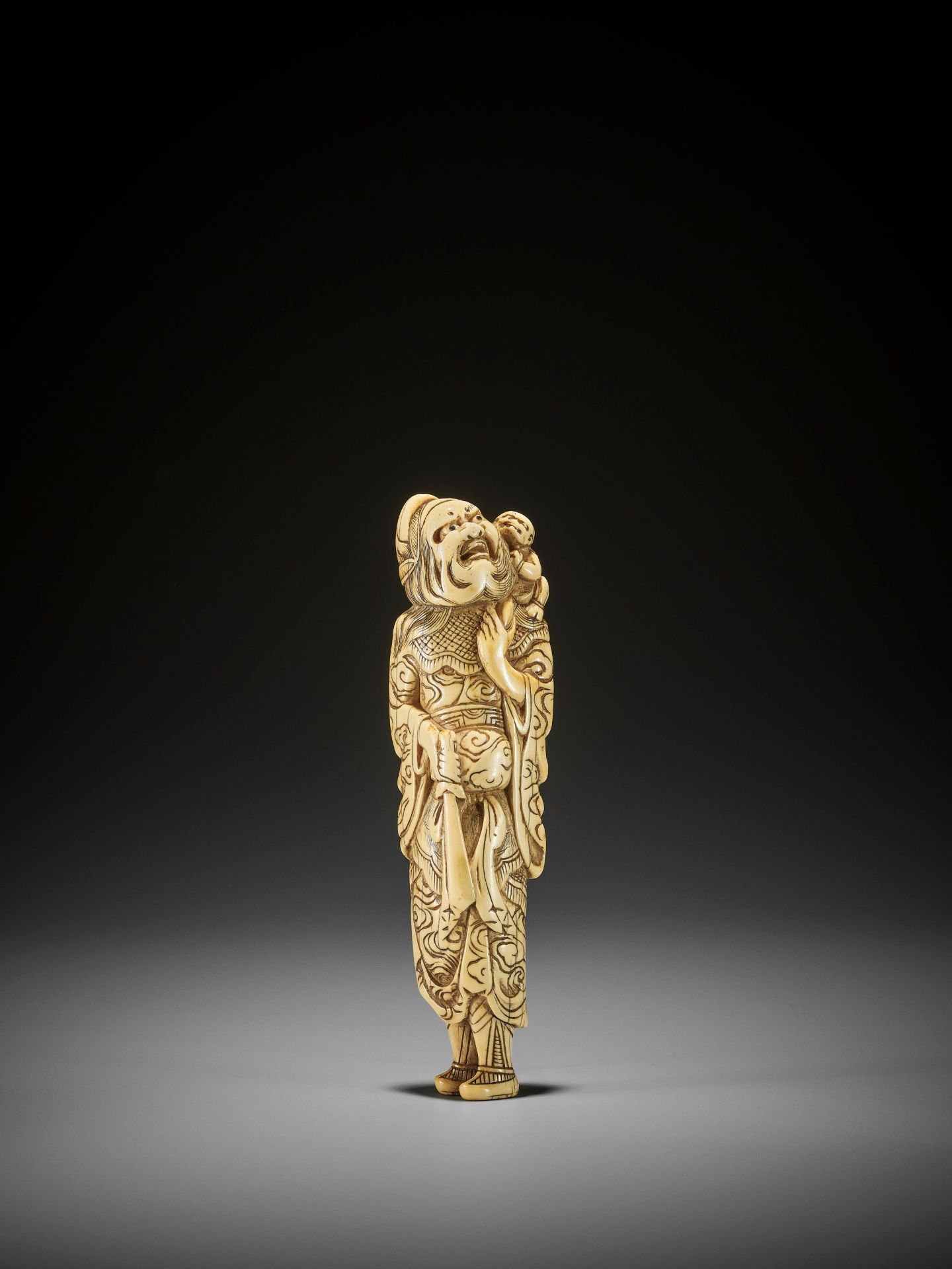 A MONUMENTALLY TALL IVORY NETSUKE OF SHOKI AND ONI - Image 4 of 8