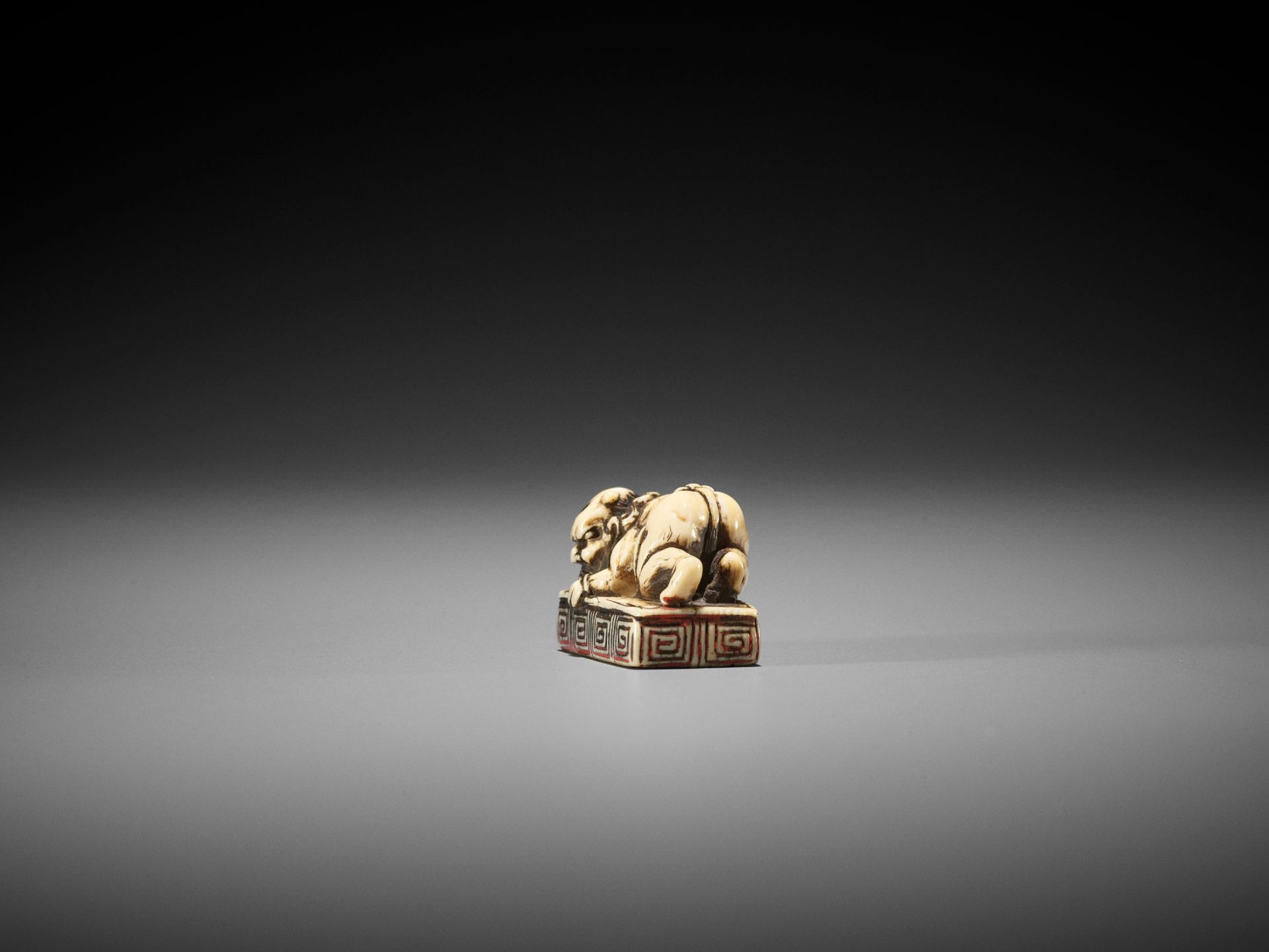 A RARE IVORY SEAL NETSUKE WITH AN ONI - Image 6 of 8