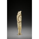 A RARE AND TALL IVORY NETSUKE OF A FOREIGNER
