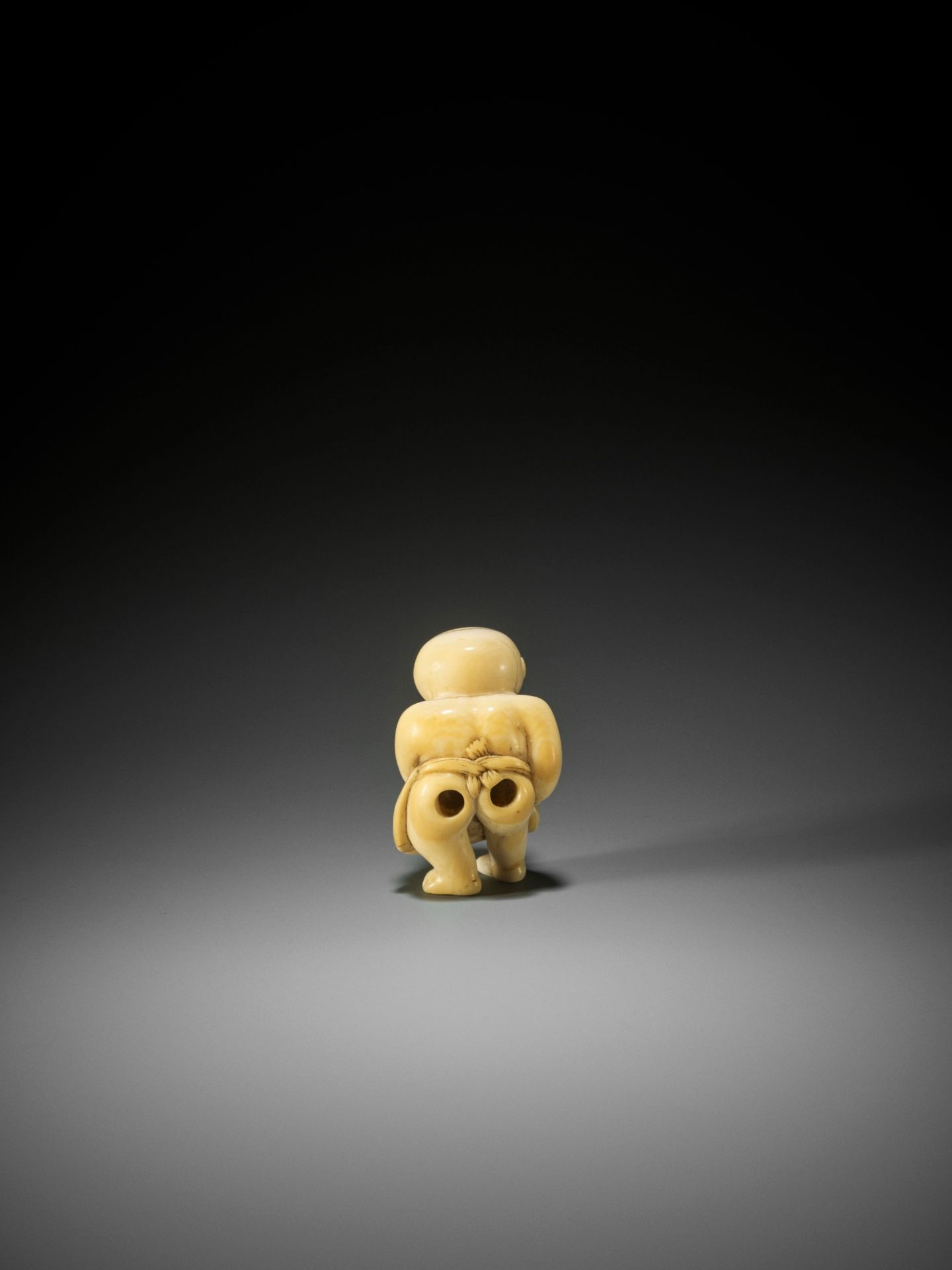 A RARE AND CHARMING IVORY NETSUKE OF A YOUNG SUMO WRESTLER - Image 2 of 10