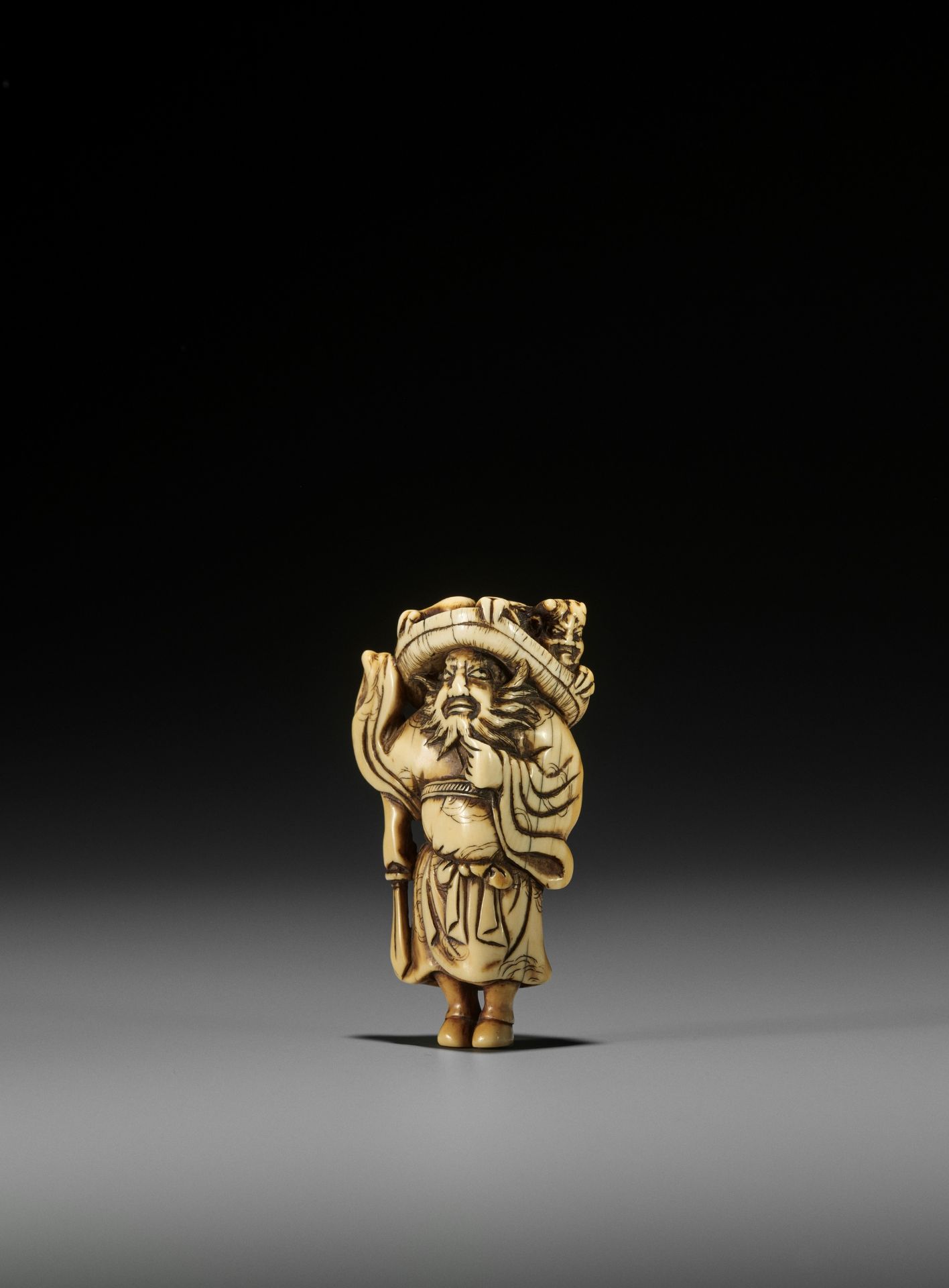 A POWERFUL KYOTO SCHOOL IVORY NETSUKE OF SHOKI AND ONI