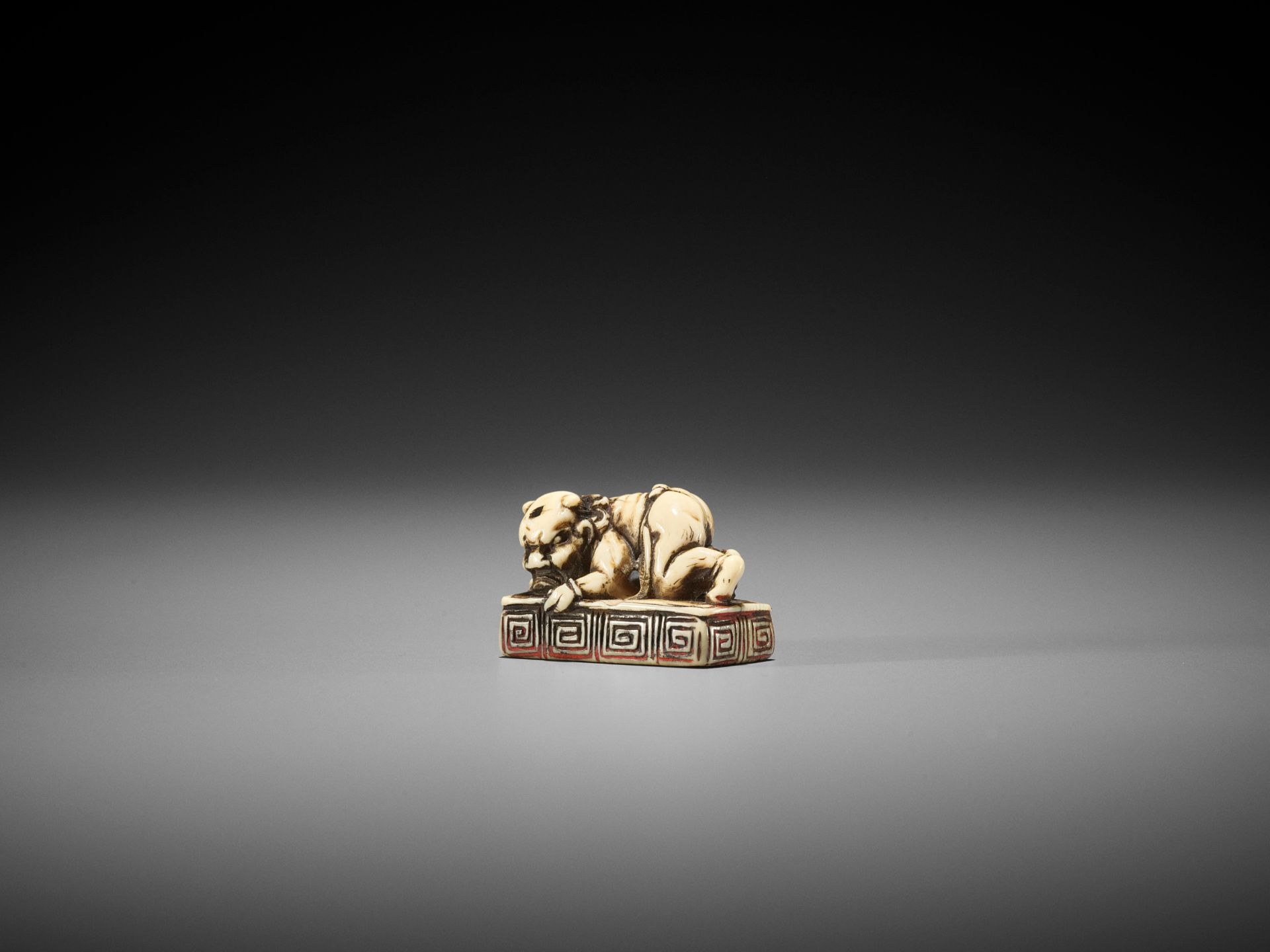 A RARE IVORY SEAL NETSUKE WITH AN ONI - Image 5 of 8