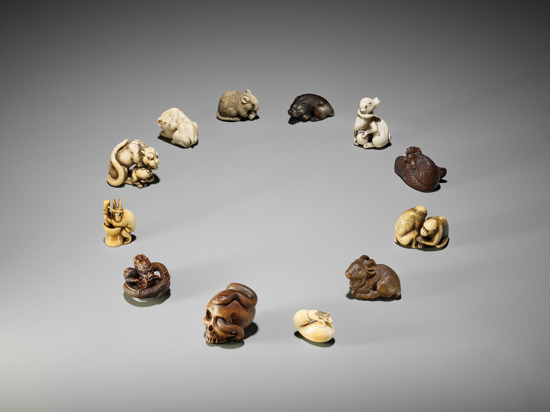 TOMOTADA: AN EXCEPTIONAL IVORY NETSUKE OF A TIGRESS AND CUB - Image 13 of 13