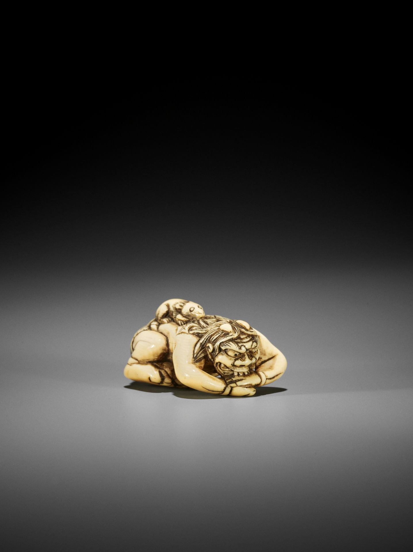 A RARE IVORY NETSUKE OF SHIRO