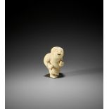 A RARE AND CHARMING IVORY NETSUKE OF A YOUNG SUMO WRESTLER