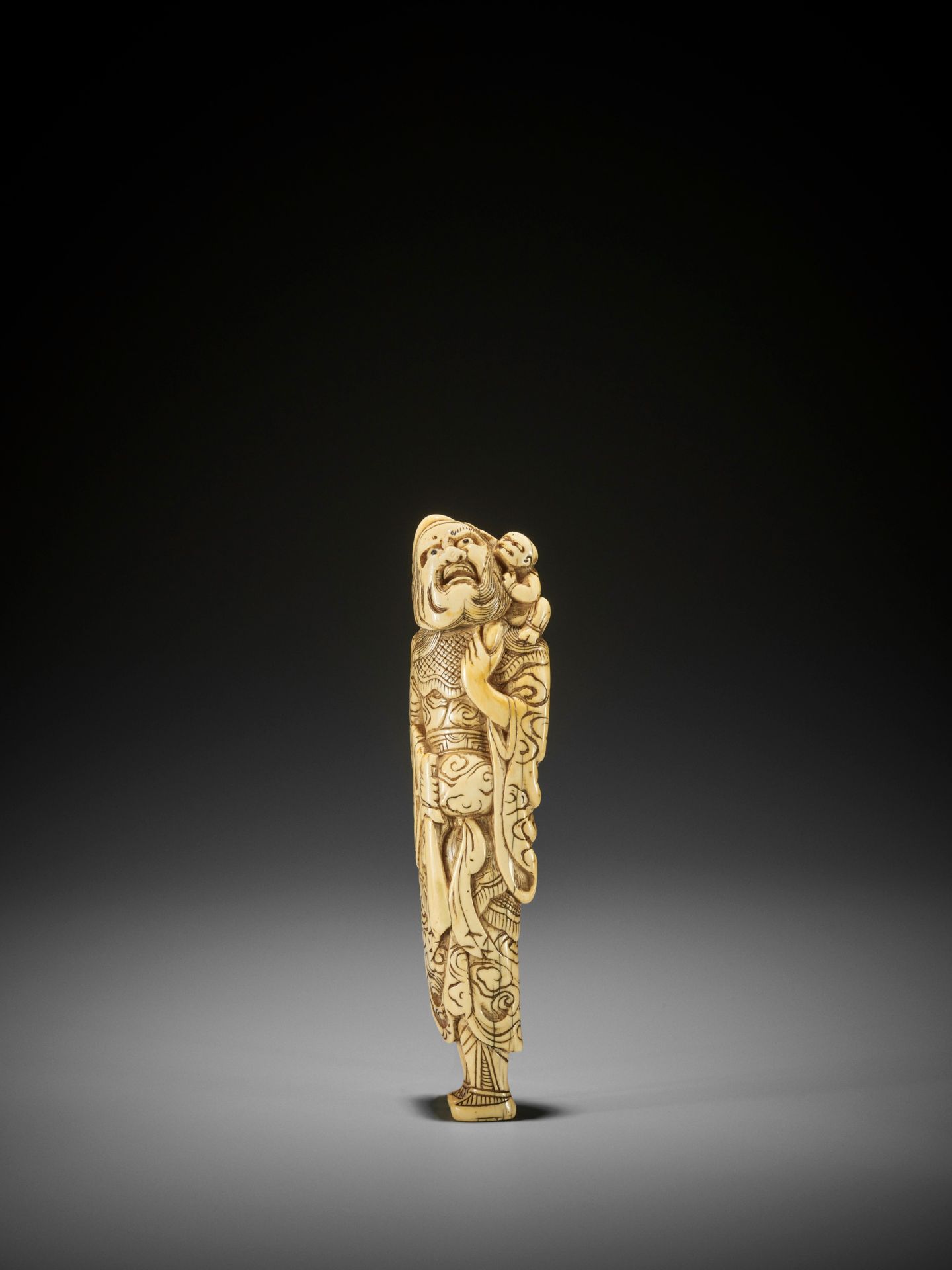 A MONUMENTALLY TALL IVORY NETSUKE OF SHOKI AND ONI - Image 7 of 8