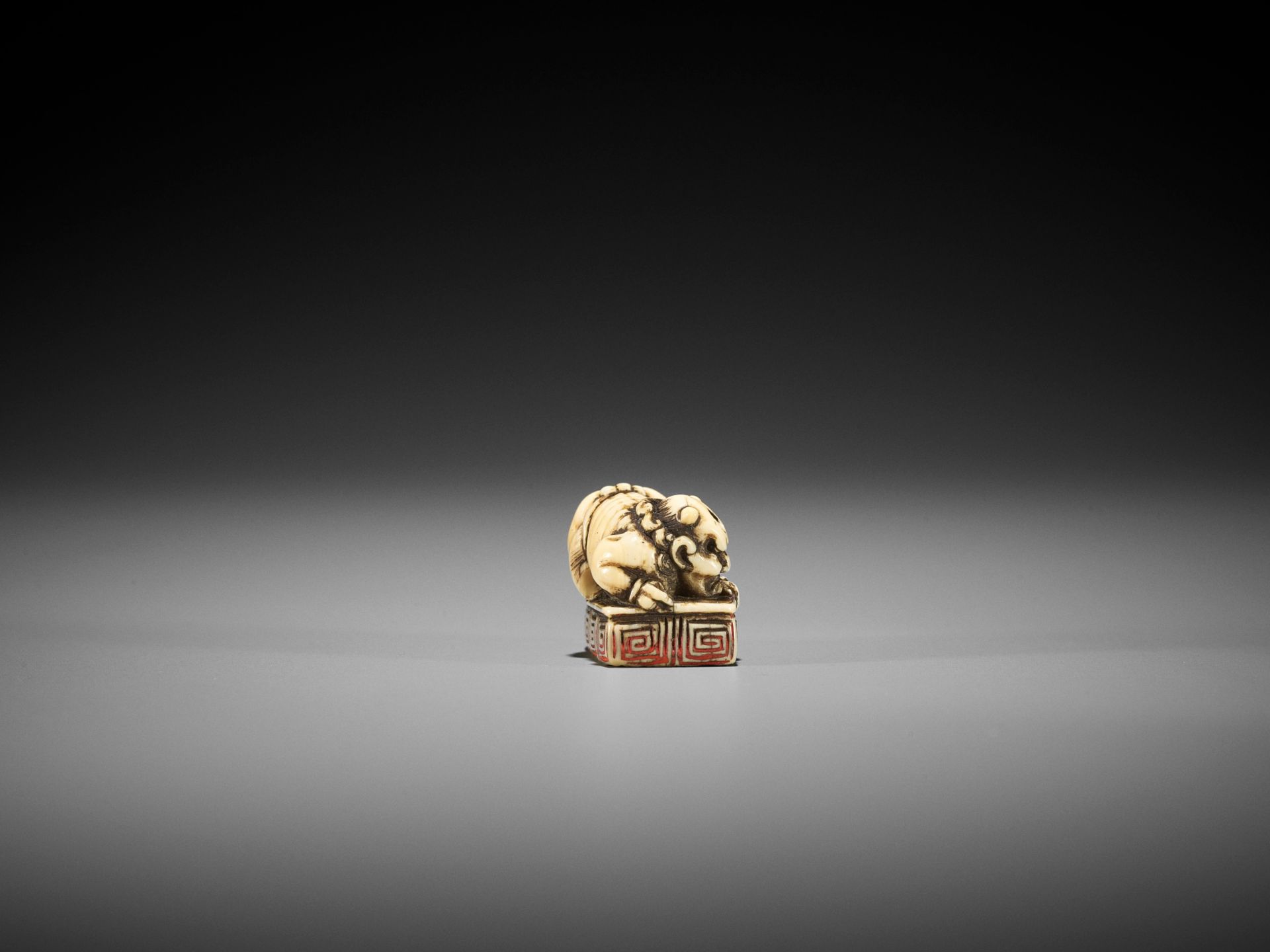 A RARE IVORY SEAL NETSUKE WITH AN ONI - Image 7 of 8