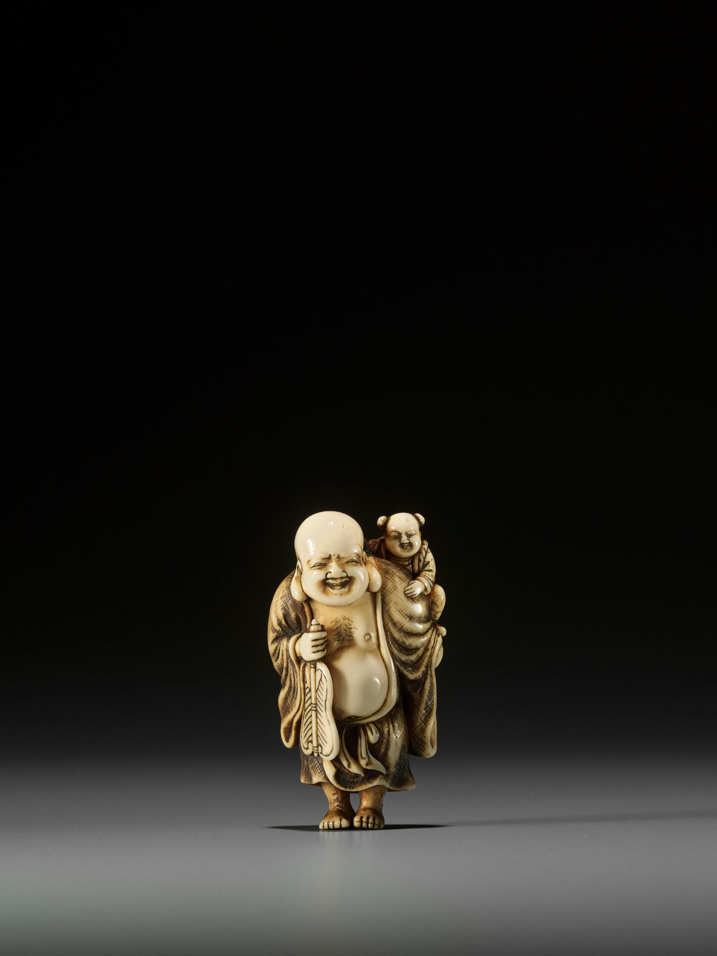 OKAKOTO: AN IVORY NETSUKE OF HOTEI WITH KARAKO - Image 3 of 10