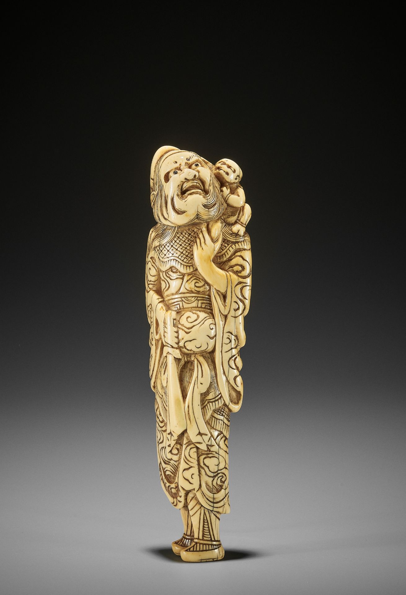 A MONUMENTALLY TALL IVORY NETSUKE OF SHOKI AND ONI - Image 2 of 8