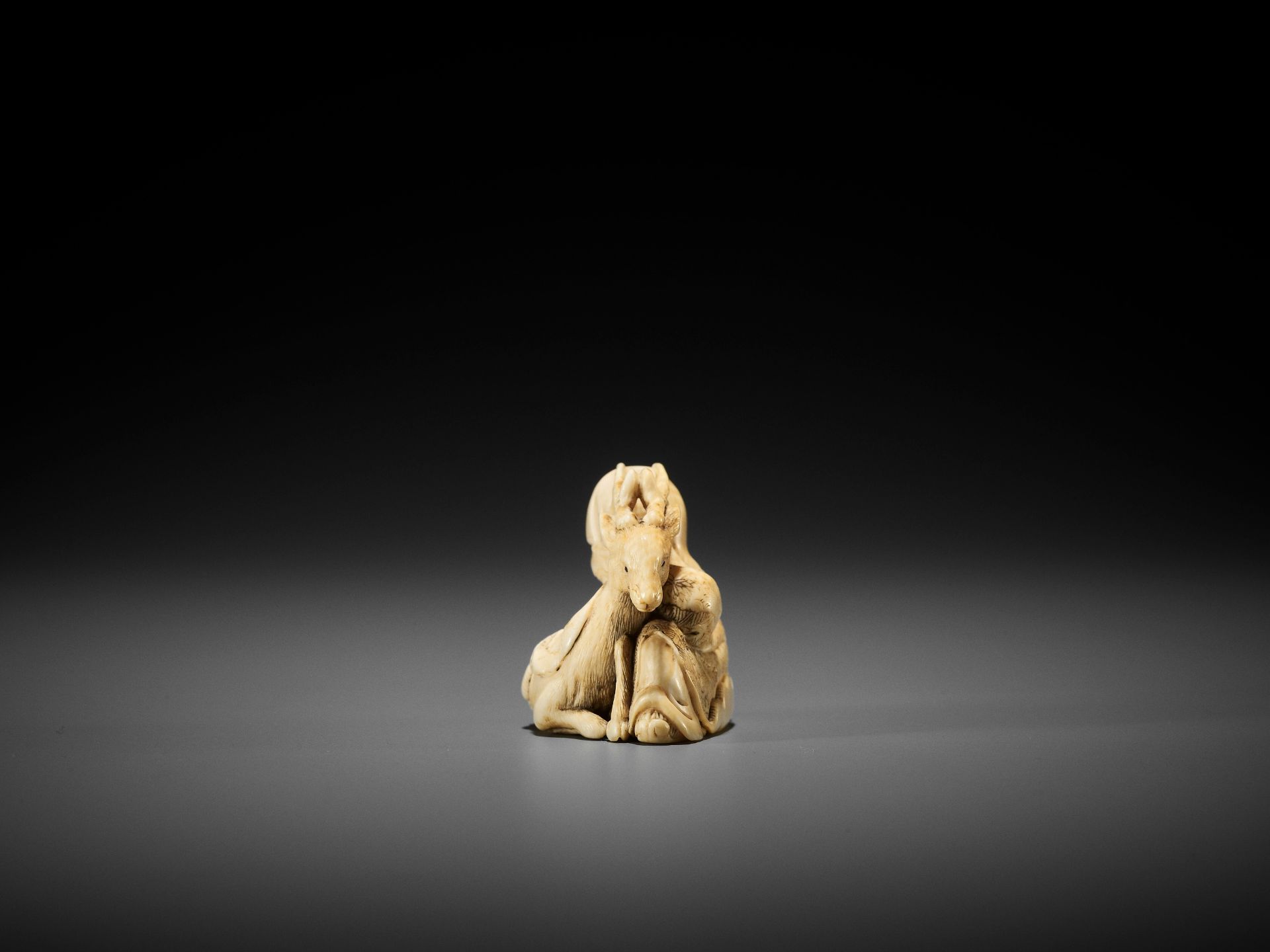 YOSHITOMO: AN IVORY NETSUKE OF JUROJIN AND DEER - Image 5 of 9