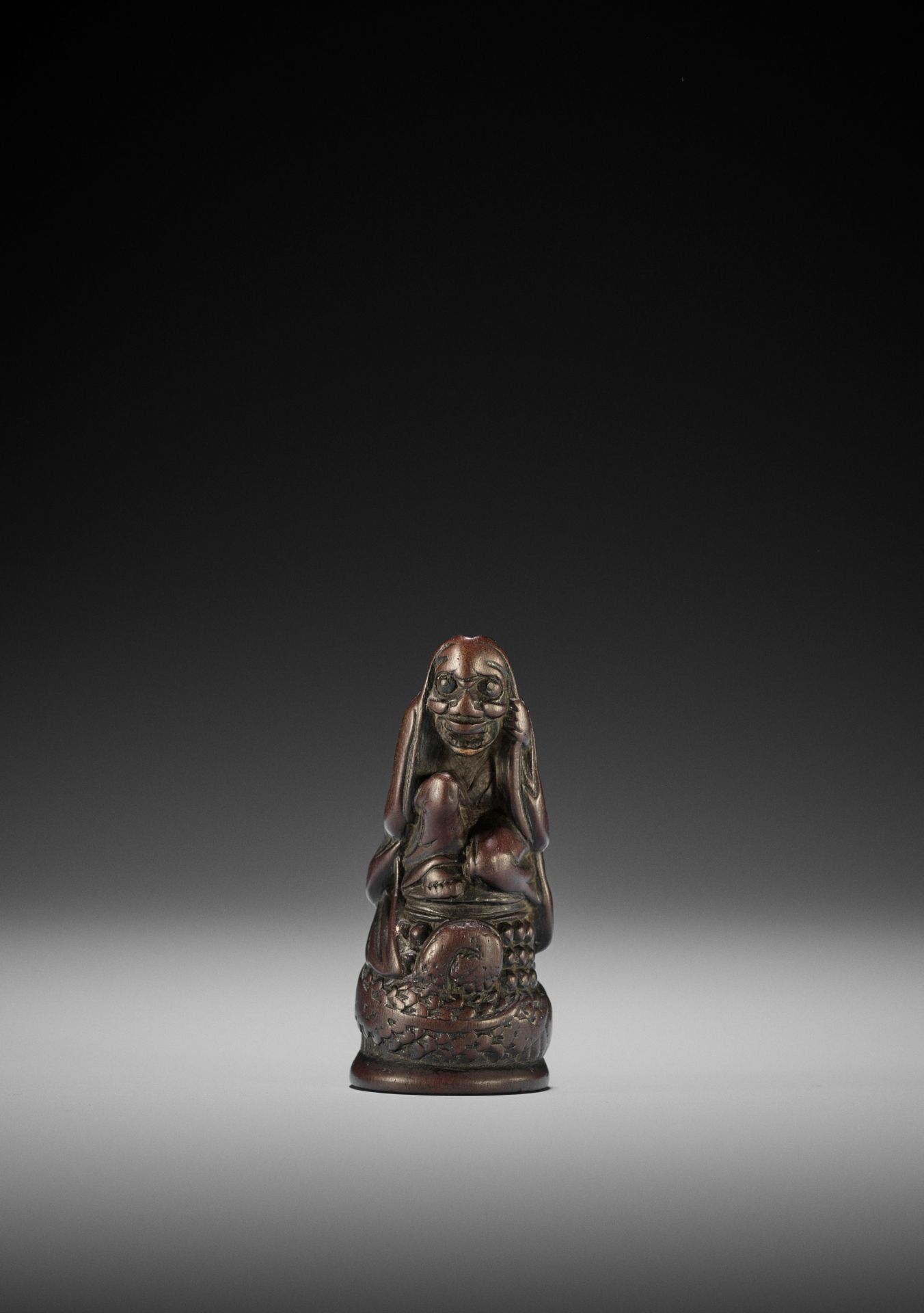 AN OLD WOOD NETSUKE OF KIYOHIME