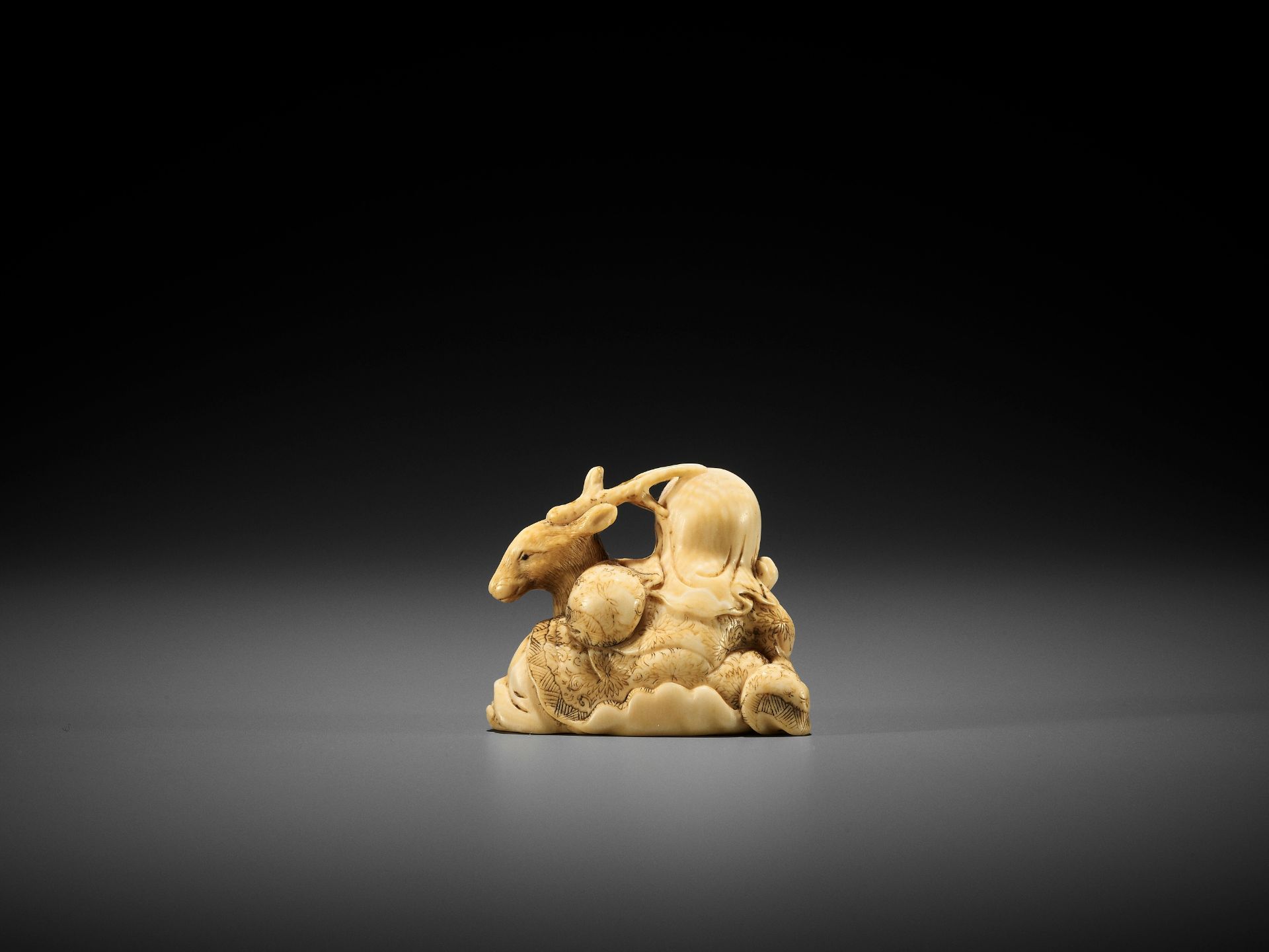 YOSHITOMO: AN IVORY NETSUKE OF JUROJIN AND DEER - Image 2 of 9