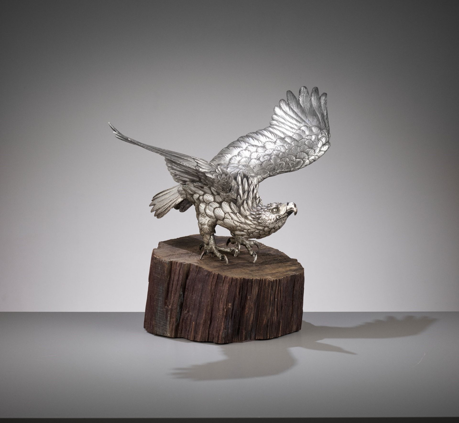 MASAMITSU: AN IMPRESSIVE SILVERED BRONZE OKIMONO OF AN EAGLE