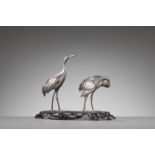 MUSASHIYA: A FINE AND RARE SILVERED OKIMONO OF A PAIR OF CRANES