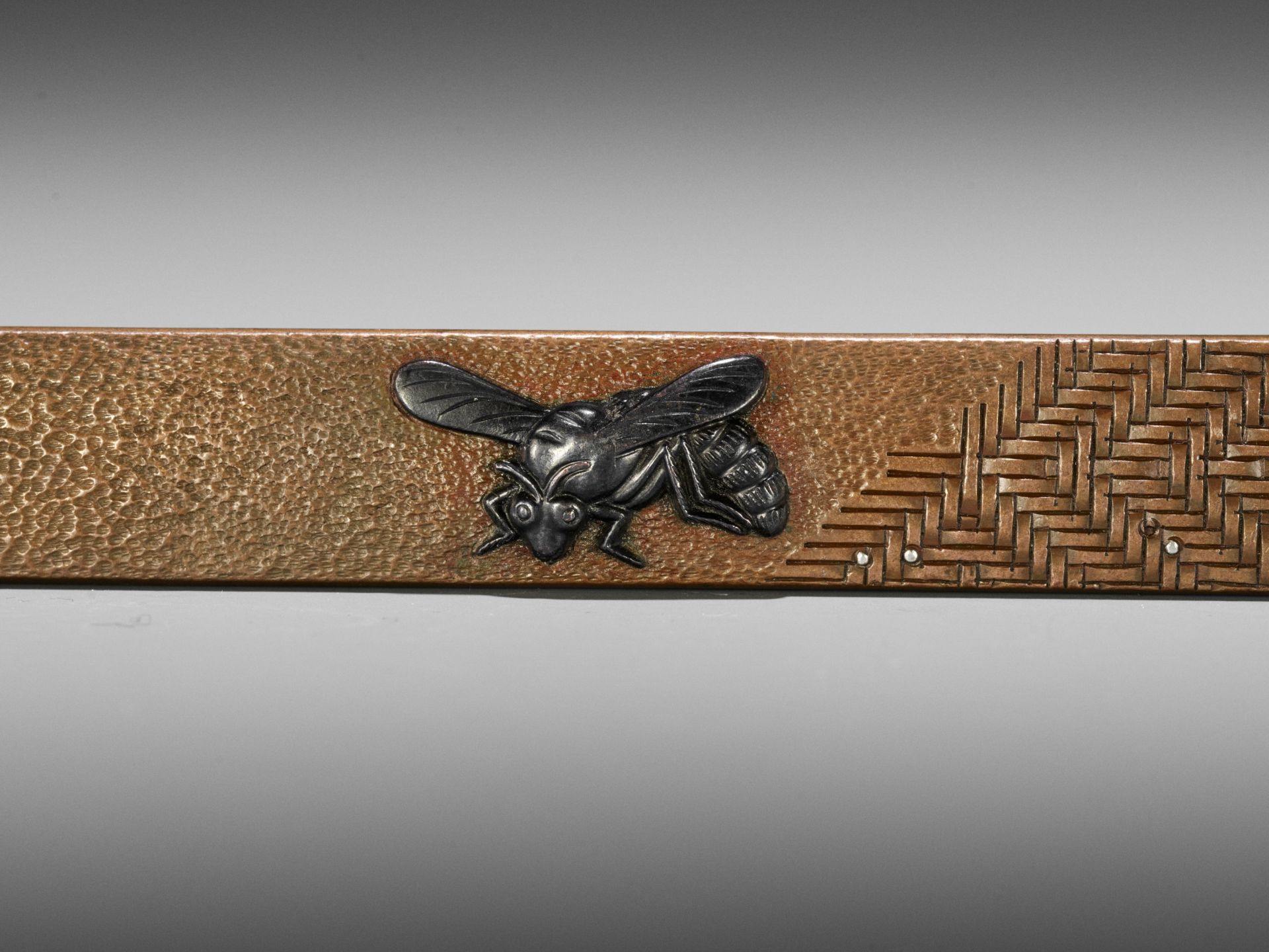 A SILVER AND SHAKUDO-INLAID COPPER KOZUKA WITH A WASP