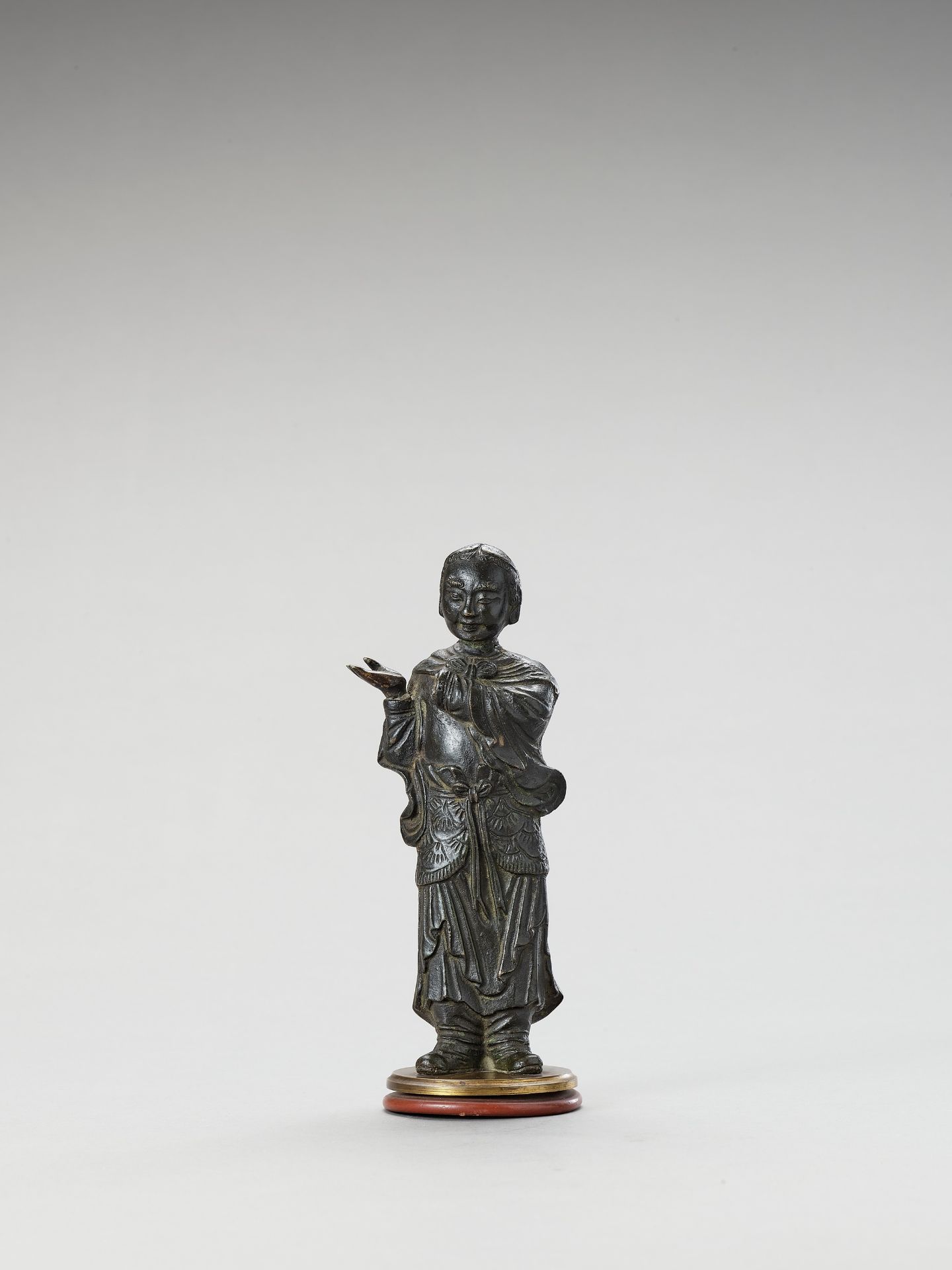 A BRONZE FIGURE OF A LUOHAN, MING