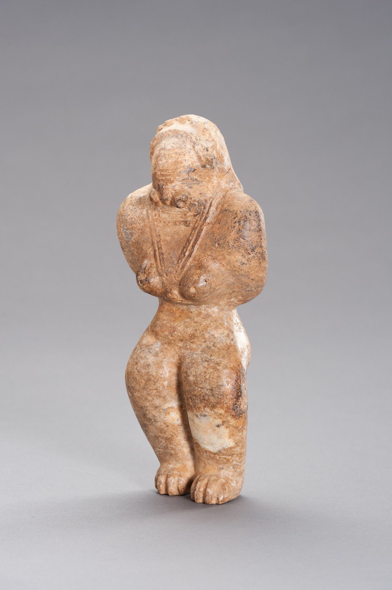 AN INDUS VALLEY STYLE STONE FIGURE OF A FERTILITY GODDESS