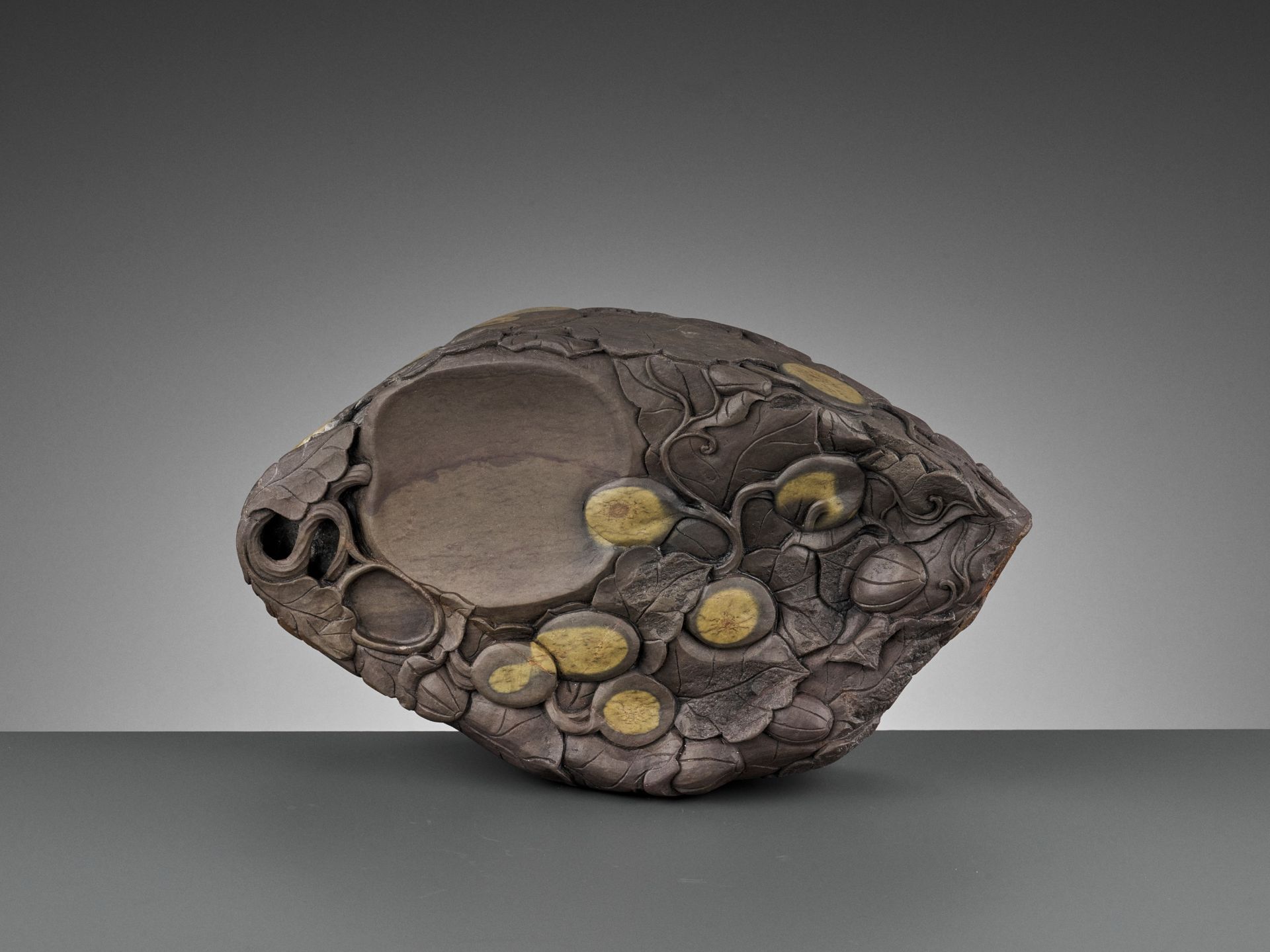 A MASSIVE CARVED 'MELON' DUAN INKSTONE, EARLY QING