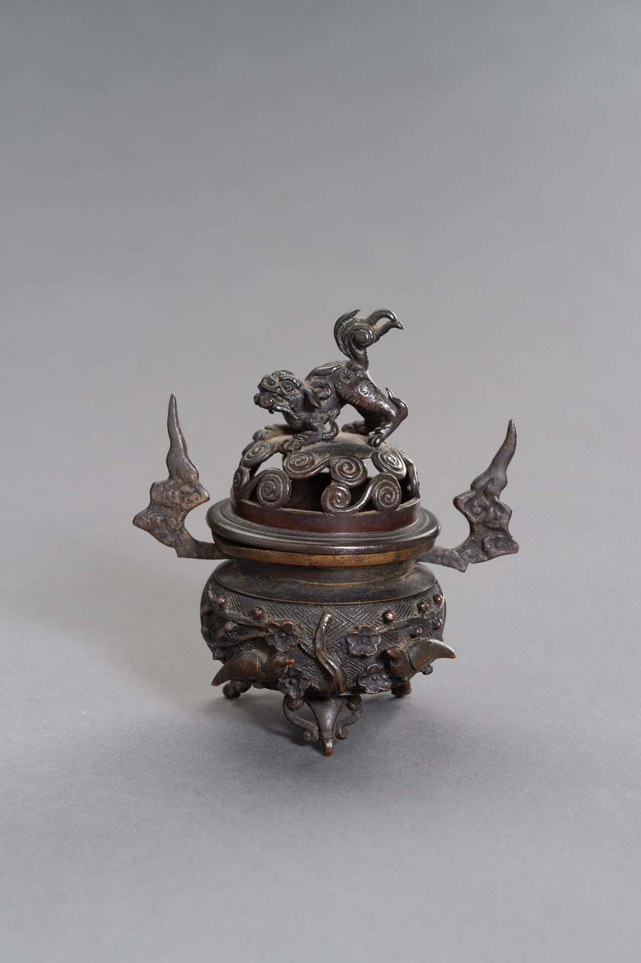 A CHINESE MINATURE BRONZE TRIPOD CENSER