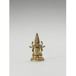 A SINO-TIBETAN GILT BRONZE FIGURE OF EKADASHAMUKHA AVALOKITESVARA, QING