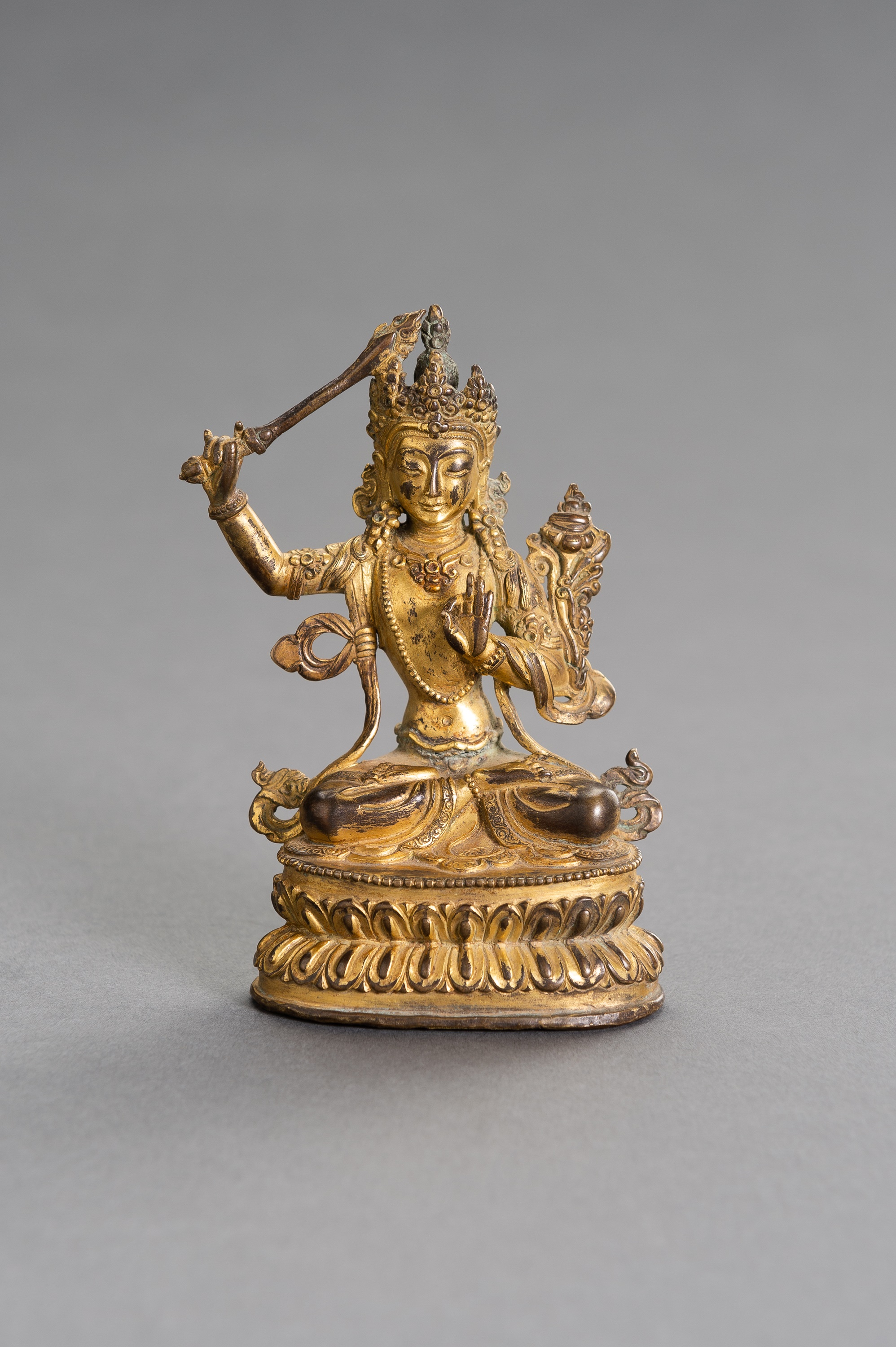 A GILT BRONZE FIGURE OF MANJUSHRI