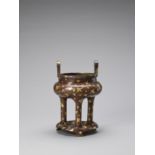 A GOLD-SPLASHED BRONZE TRIPOD CENSER WITH SIX-CHARACTER XUANDE MARK, QING
