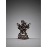 A SILVER-INLAID BRONZE FIGURE OF HERUKA AND CONSORT, QING