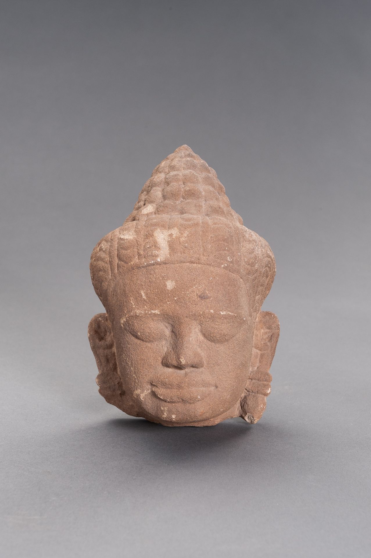 A KHMER SANDSTONE HEAD OF BUDDHA