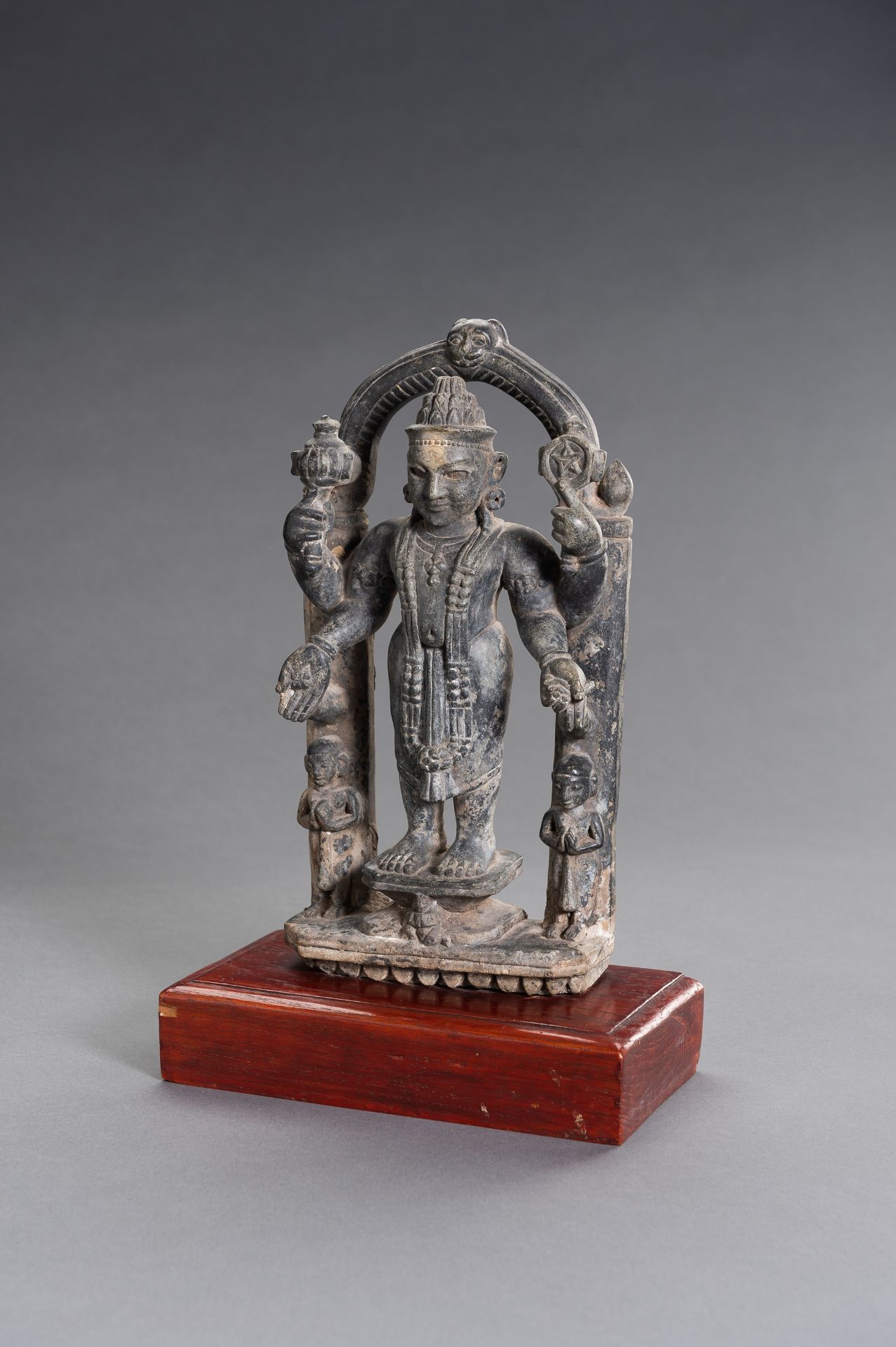 A CHOLA STYLE STONE FIGURE OF VISHNU