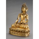 A LARGE GILT BRONZE FIGURE OF CROWNED BUDDHA SHAKYAMUNI