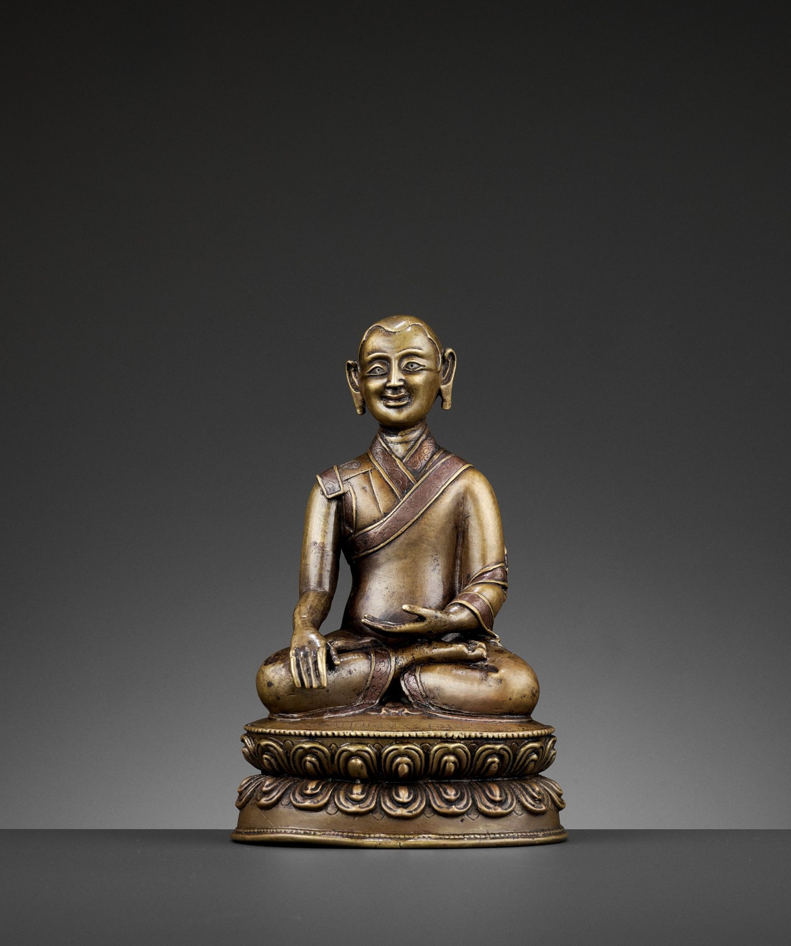 A PORTRAIT BRONZE OF A MONK, COPPER- AND SILVER-INLAID, 16TH-18TH CENTURY