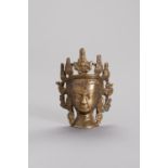 A MINIATURE BRONZE HEAD OF BODHISATTVA