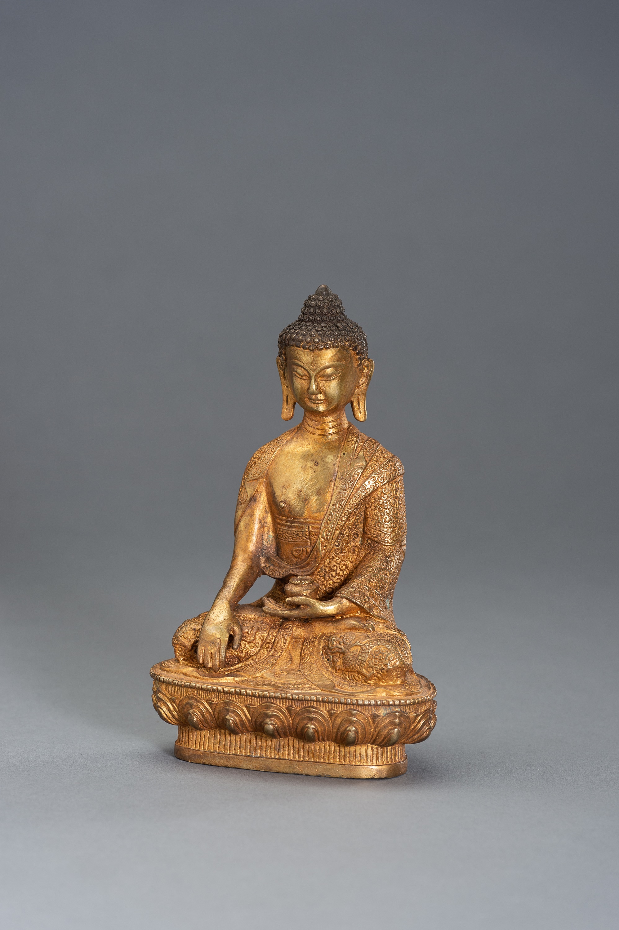 A GILT BRONZE BUDDHA