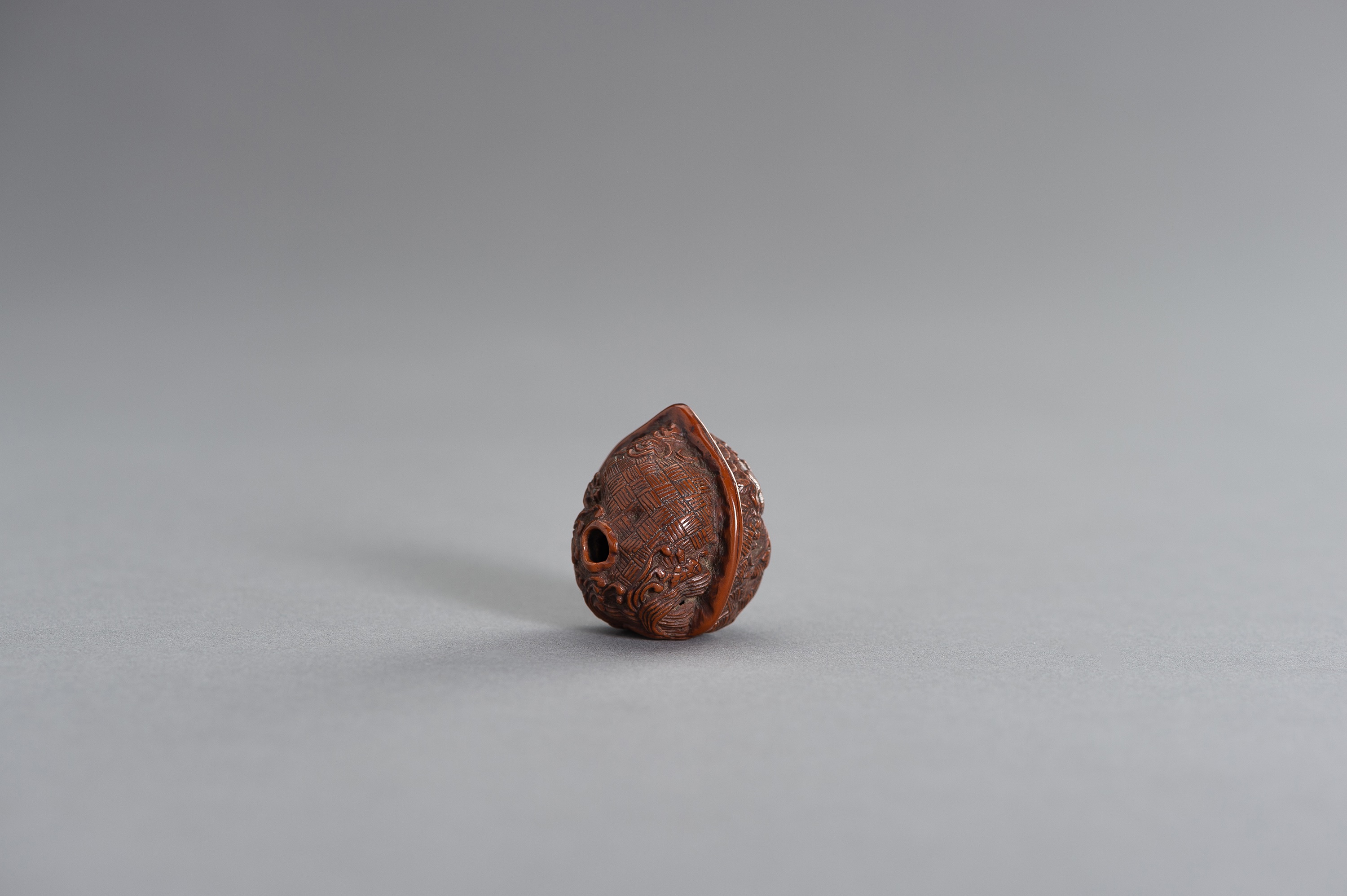 A KURUMI (WALNUT) NETSUKE OF GRAPEVINE AND SMALL ANIMALS - Image 3 of 3