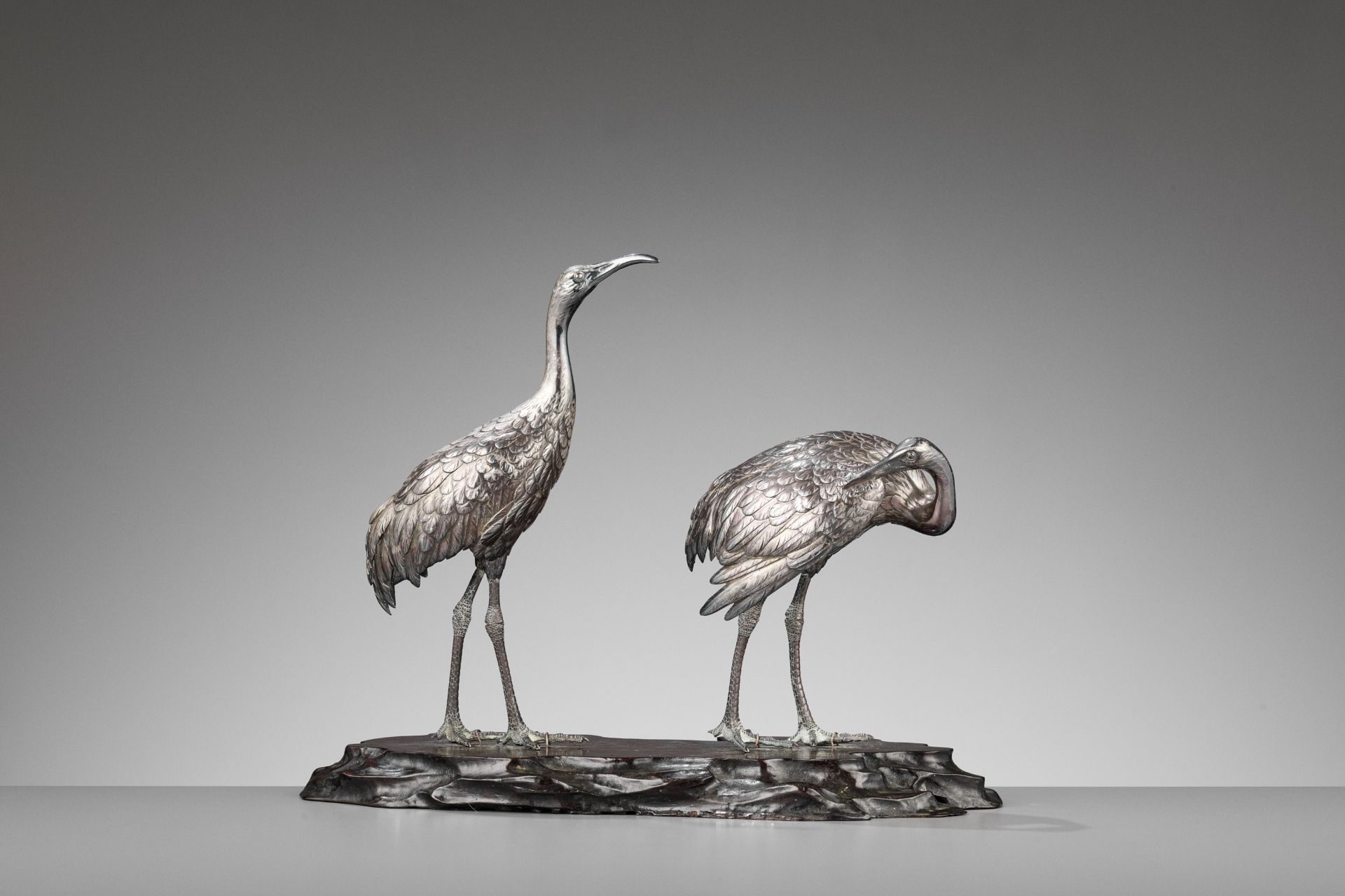 MUSASHIYA: A FINE AND RARE SILVERED OKIMONO OF A PAIR OF CRANES