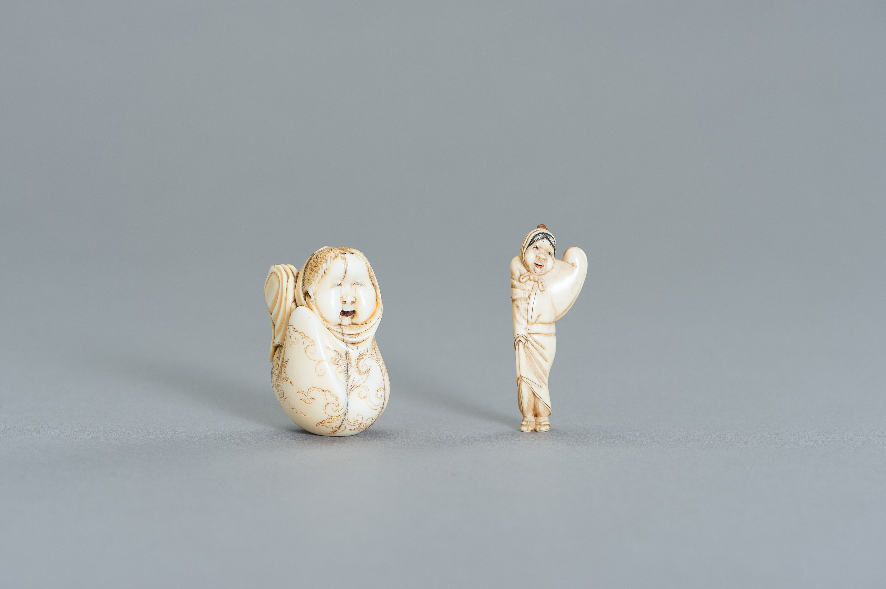 A GROUP OF TWO IVORY NETSUKE OF OKAME - Image 2 of 3