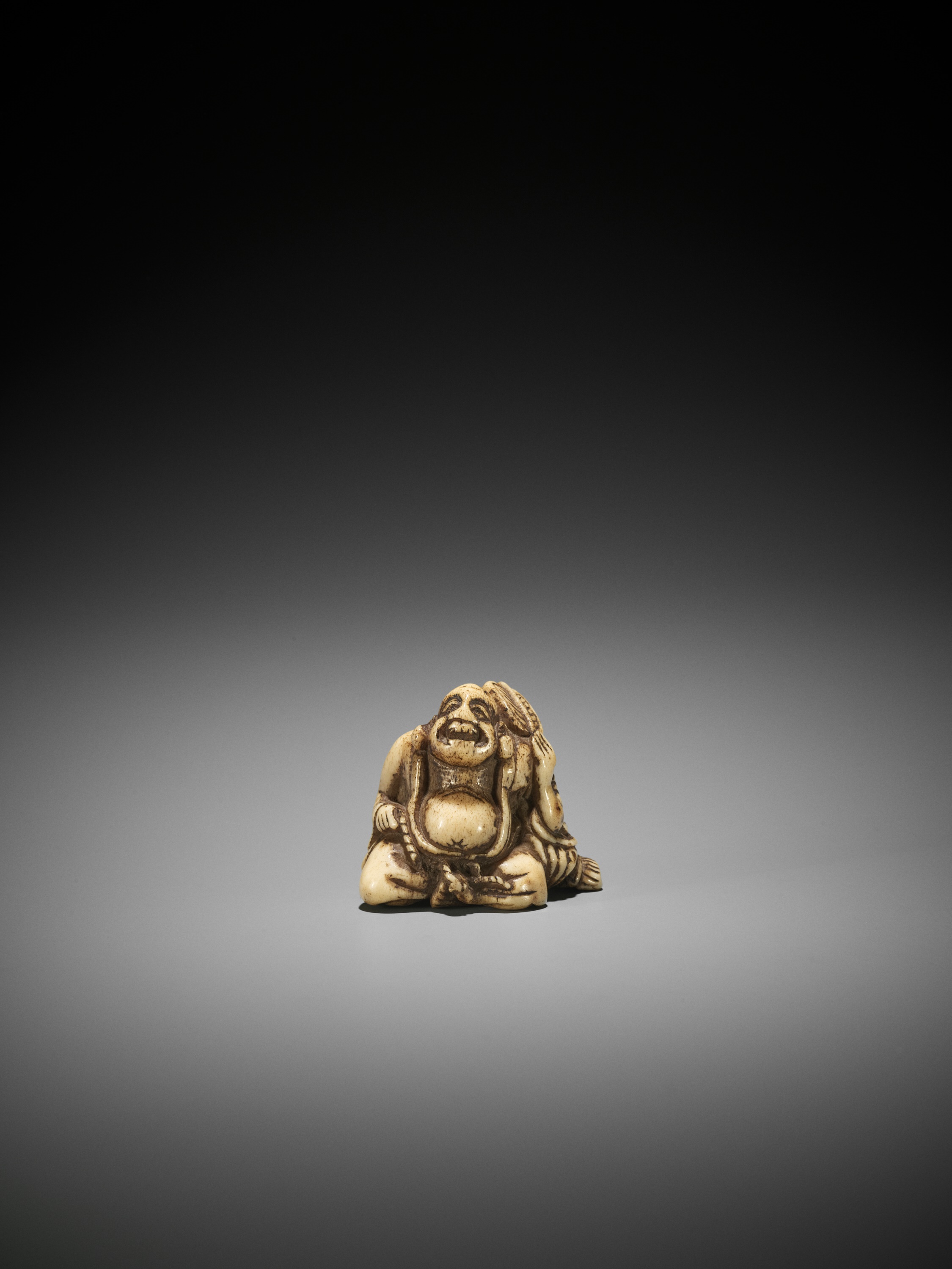 A STAG ANTLER NETSUKE OF HOTEI - Image 2 of 3