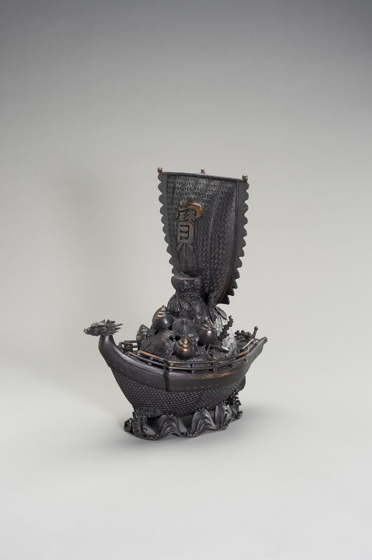 A LARGE BRONZE CENSER IN THE SHAPE OF A TREASURE SHIP