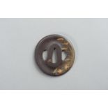 AN IRON TSUBA WITH REED AND LEAF