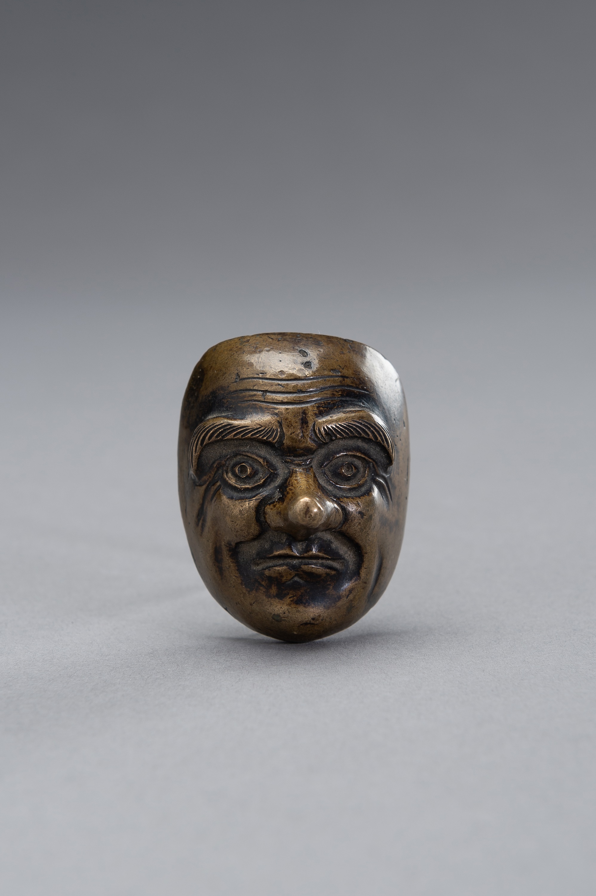A BRONZE SCROLL WEIGHT IN THE SHAPE OF A NOH MASK - Image 2 of 9