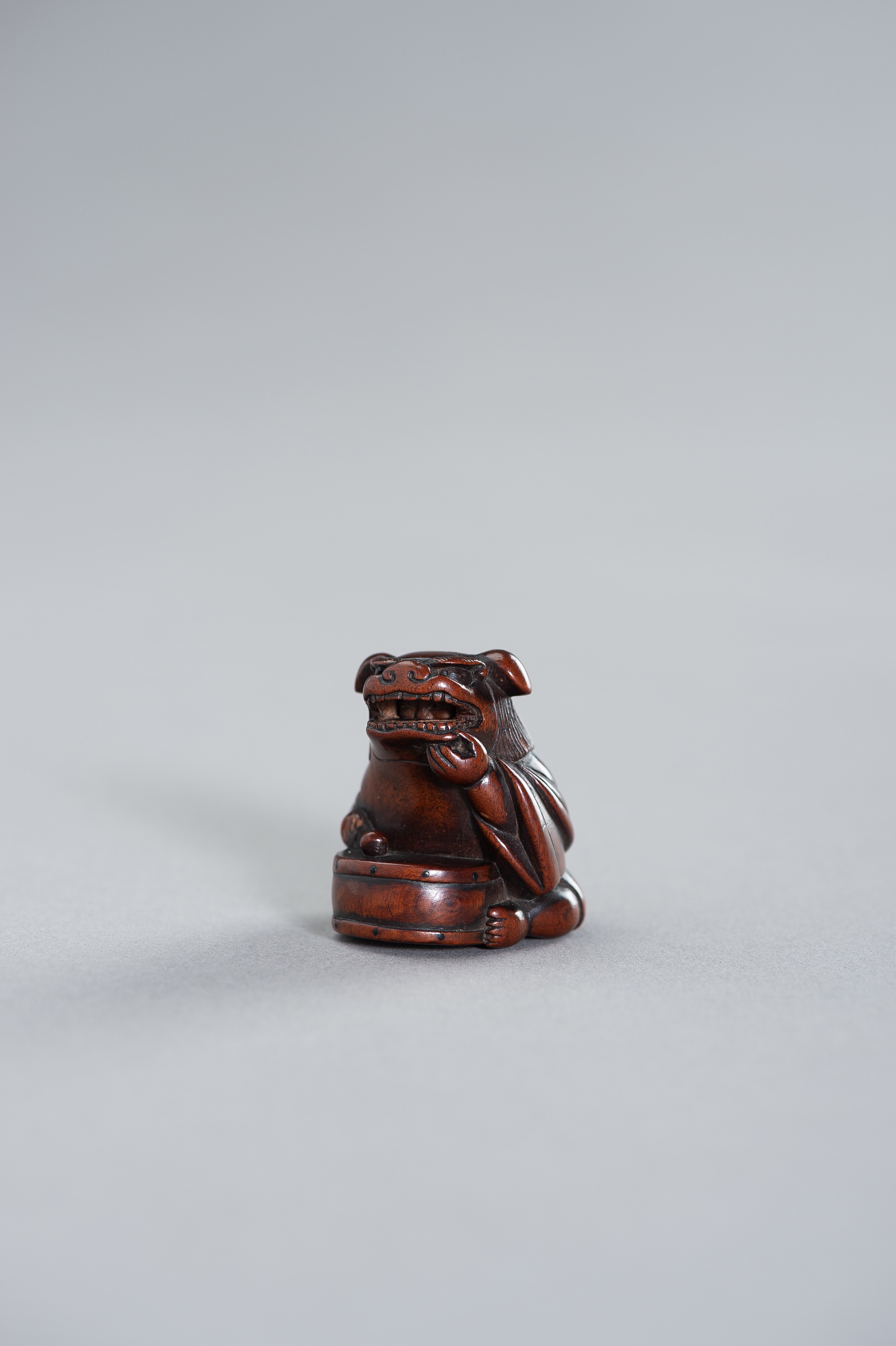 TAMETAKA: A NAGOYA SCHOOL WOOD NETSUKE OF A BOY WITH SHISHIMAI COSTUME - Image 2 of 2