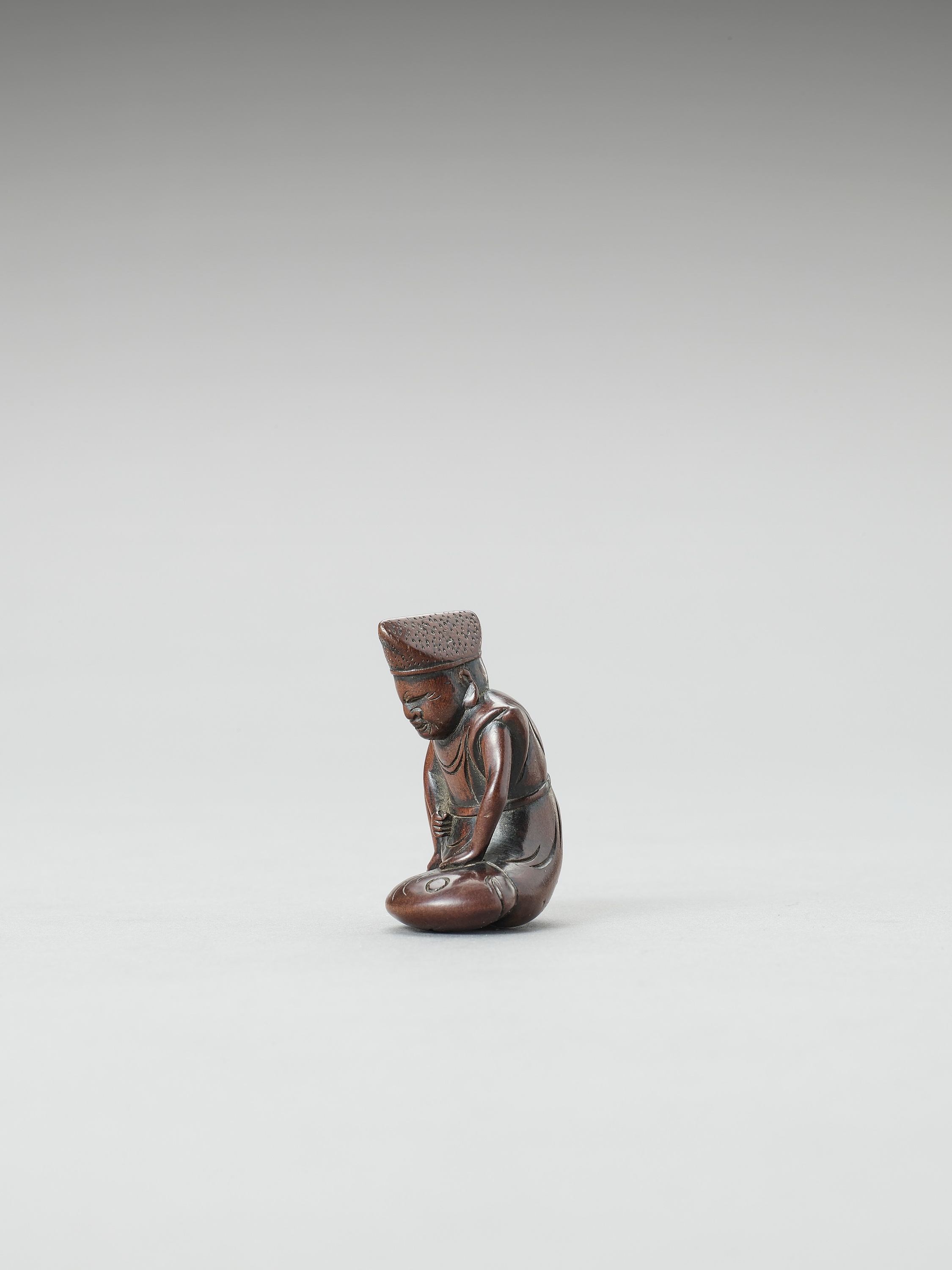 A WOOD NETSUKE OF EBISU SUBDUING A TAI FISH - Image 3 of 3